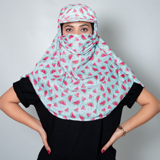 Women wearing a watermelon patterned cap scarf against a plain background