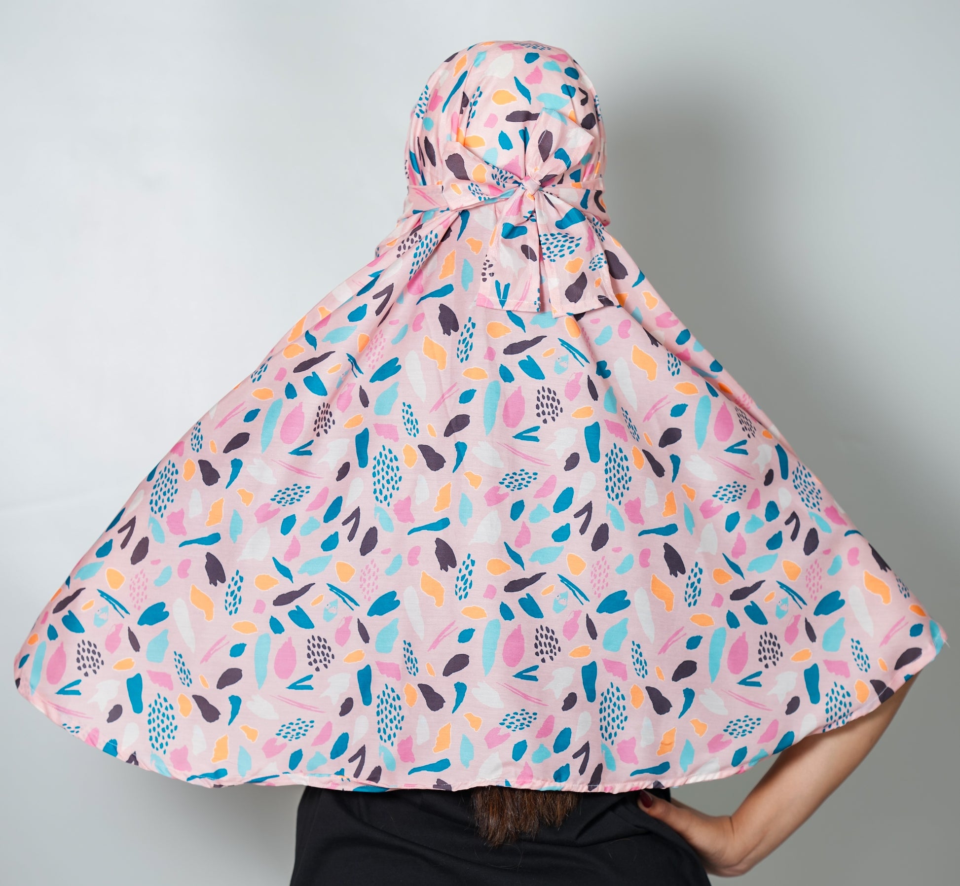 Colorful patterned scarf on a plain background