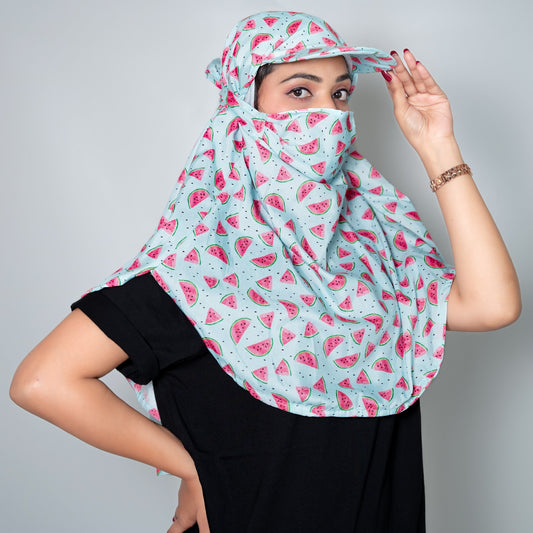 women wearing a watermelon patterned scarf on a plain background